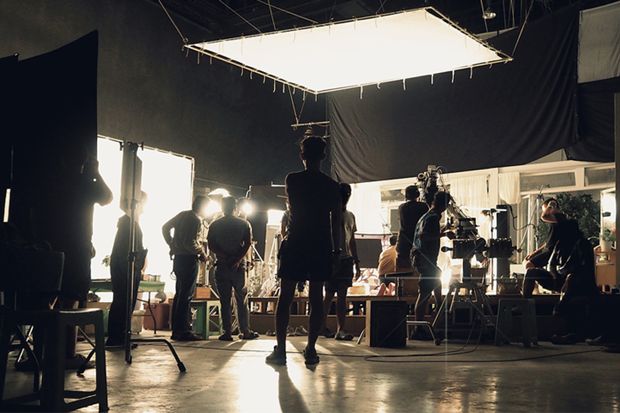 Behind the Scenes photo of a film set and crew. First Water Studios